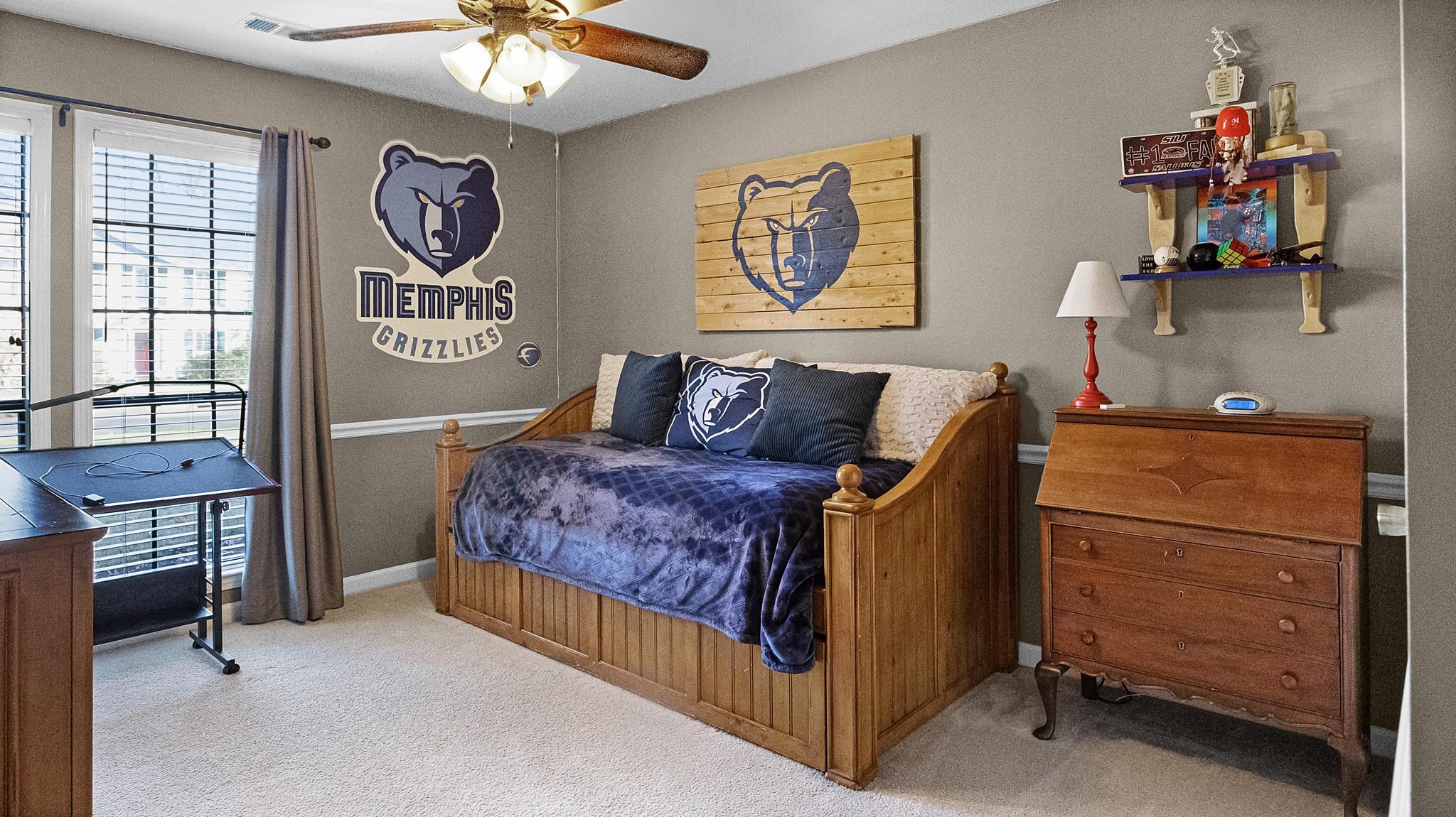 1883 Edwards Mill Road Germantown, TN 38139 - Photo 19 of 40 a bedroom with a bed and a chandelier