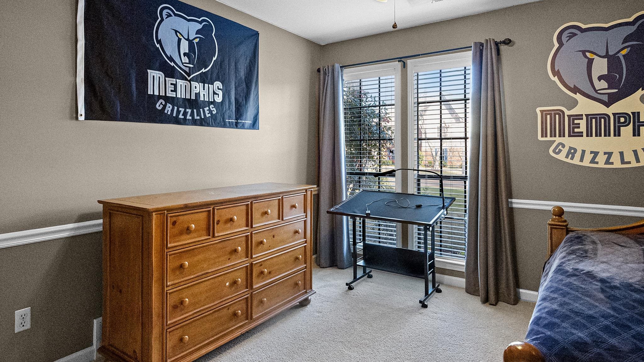 1883 Edwards Mill Road Germantown, TN 38139 - Photo 20 of 40 a bedroom with a bed and a window