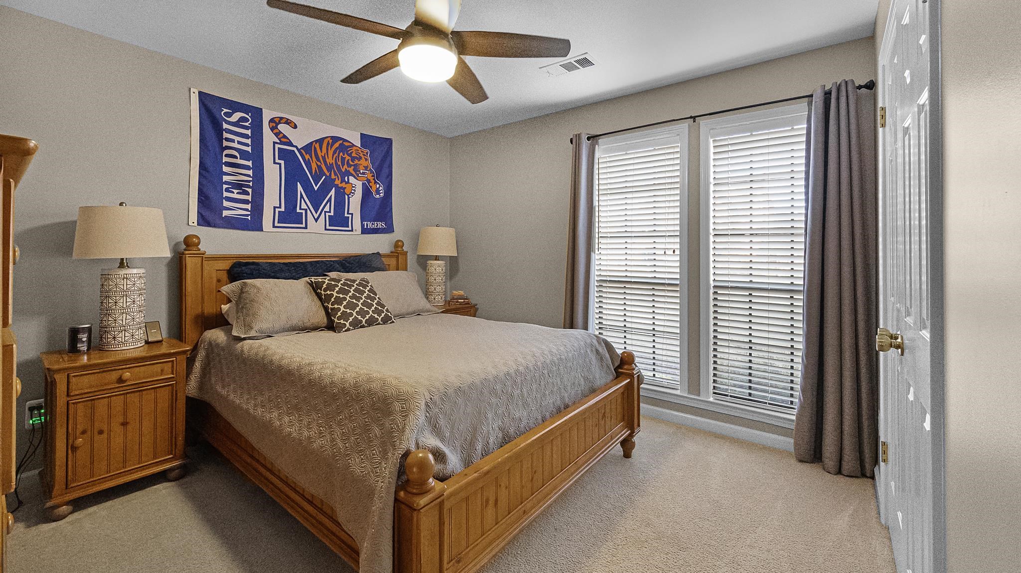 1883 Edwards Mill Road Germantown, TN 38139 - Photo 22 of 40 a bed sitting in a bedroom next to a window