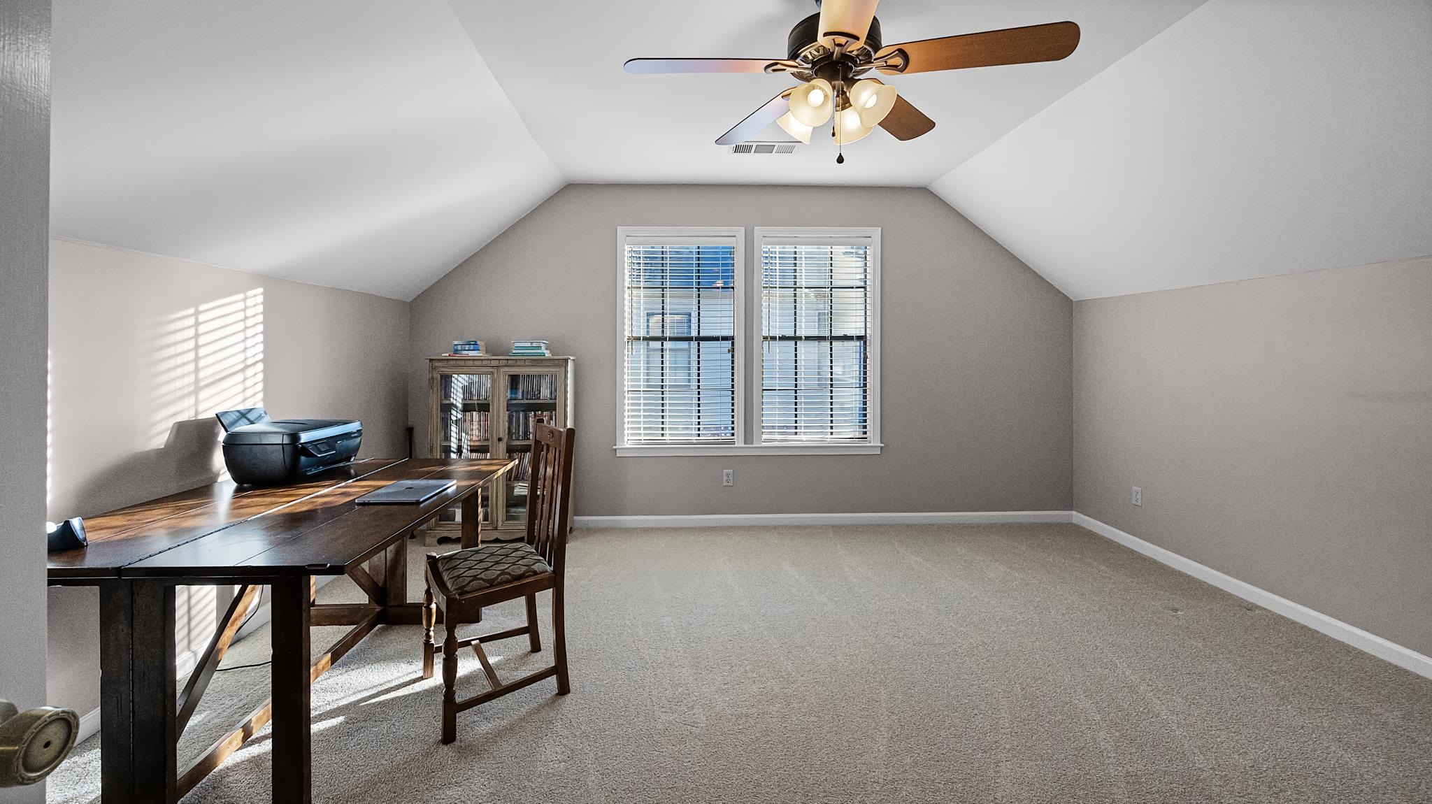 1883 Edwards Mill Road Germantown, TN 38139 - Photo 25 of 40 a view of a workspace with furniture and a window