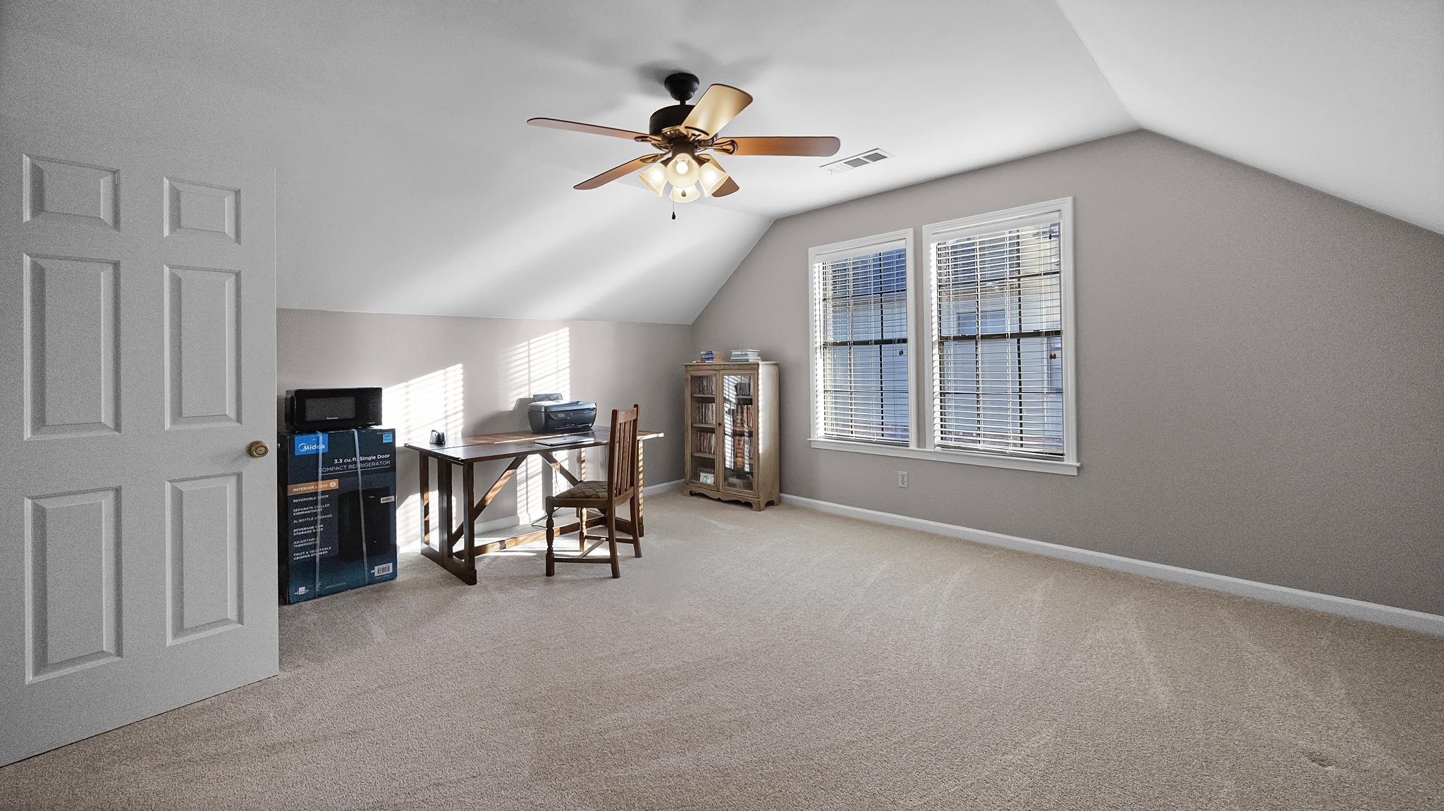 1883 Edwards Mill Road Germantown, TN 38139 - Photo 26 of 40 a view of a livingroom with furniture and a ceiling fan