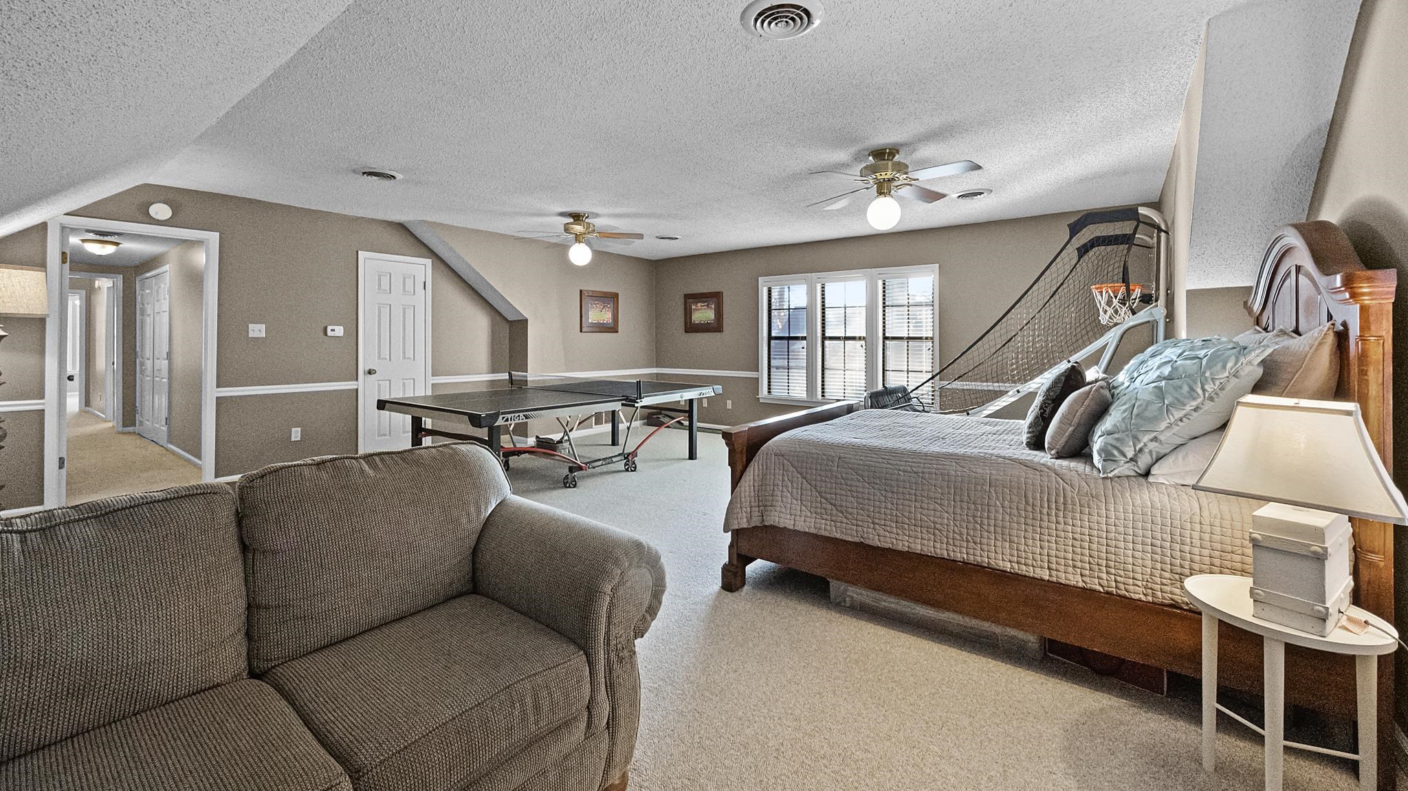 1883 Edwards Mill Road Germantown, TN 38139 - Photo 29 of 40 a living room with furniture and a chandelier
