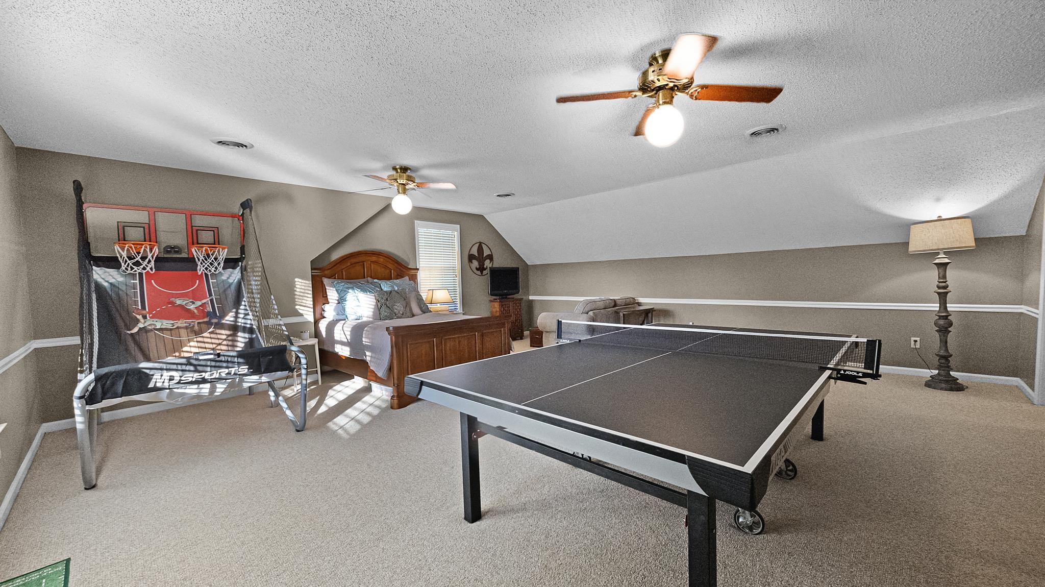 1883 Edwards Mill Road Germantown, TN 38139 - Photo 30 of 40 a room with gym equipment and a chandelier