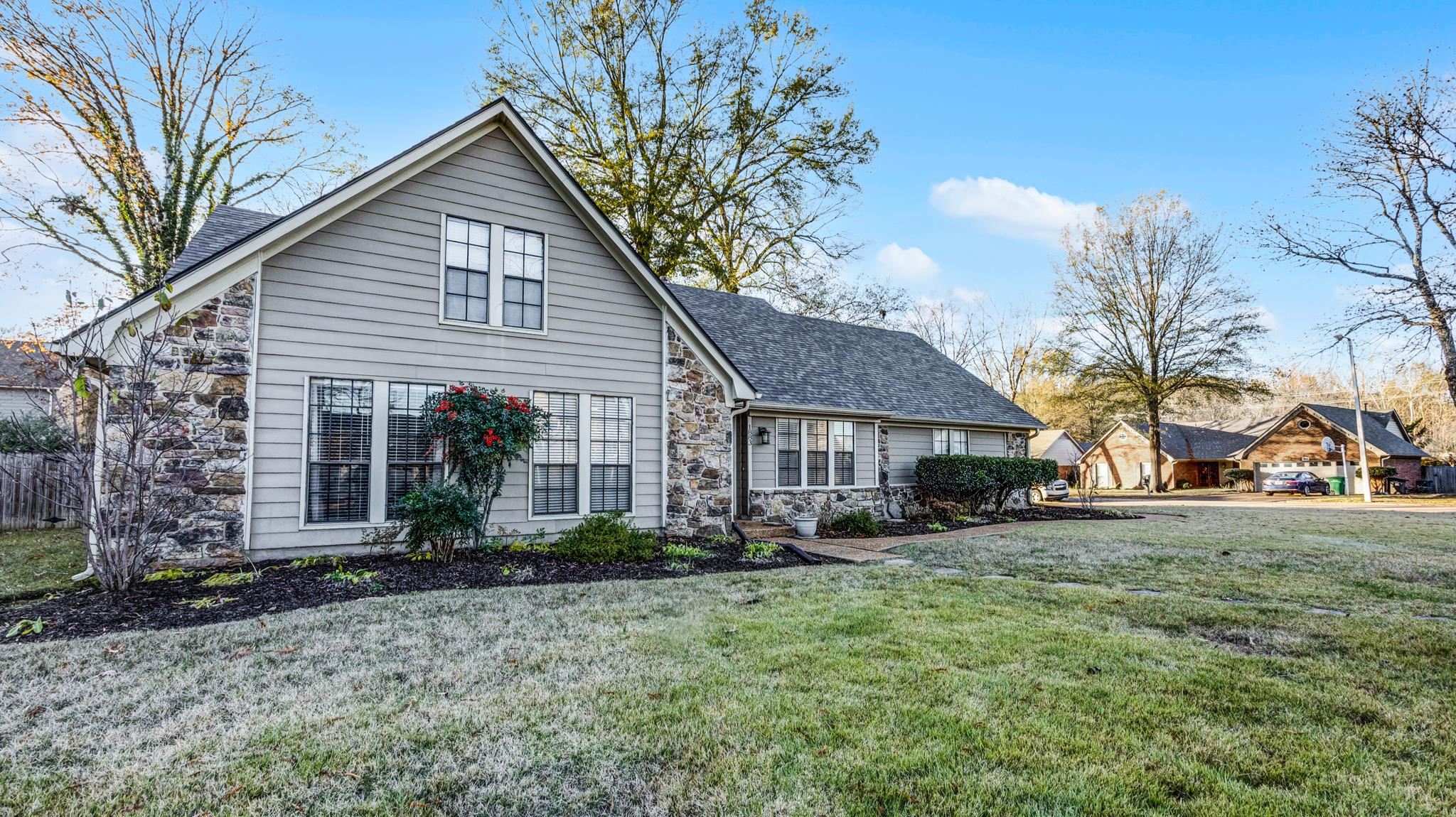 1883 Edwards Mill Road Germantown, TN 38139 - Photo 3 of 40 a front view of a house with a yard and garage