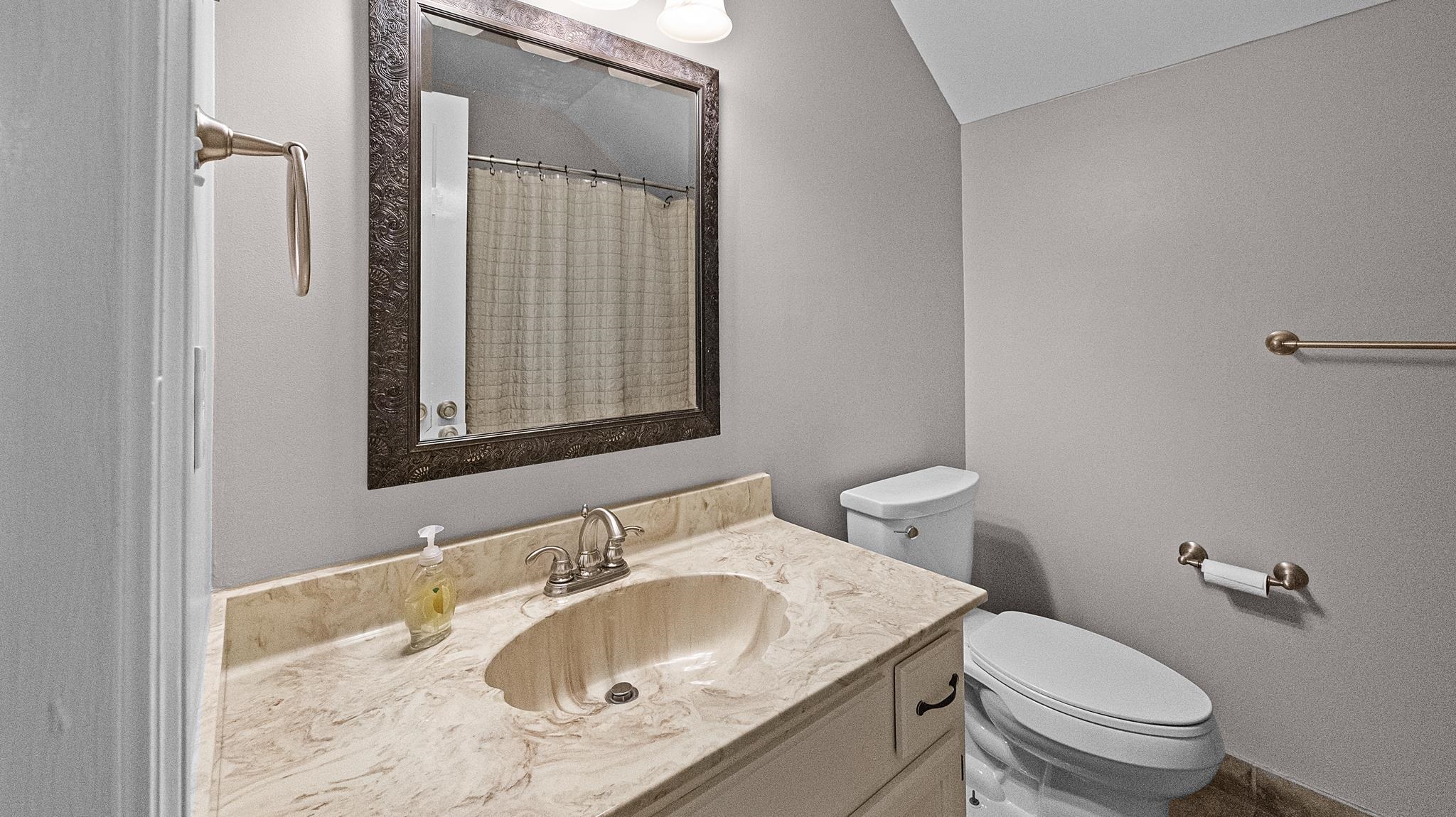 1883 Edwards Mill Road Germantown, TN 38139 - Photo 33 of 40 a bathroom with a sink and a toilet