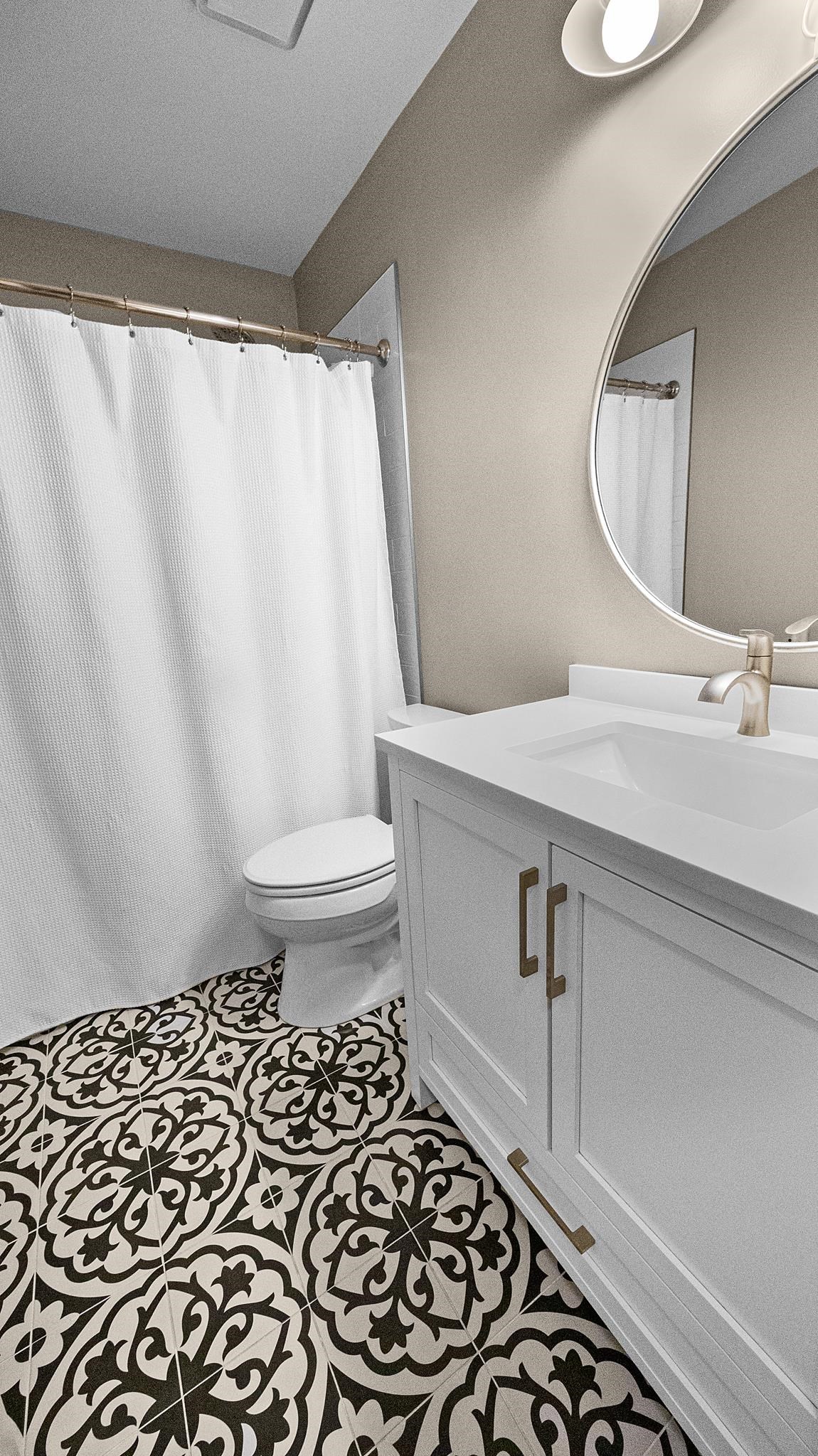 1883 Edwards Mill Road Germantown, TN 38139 - Photo 34 of 40 a bathroom with a sink a toilet and a mirror