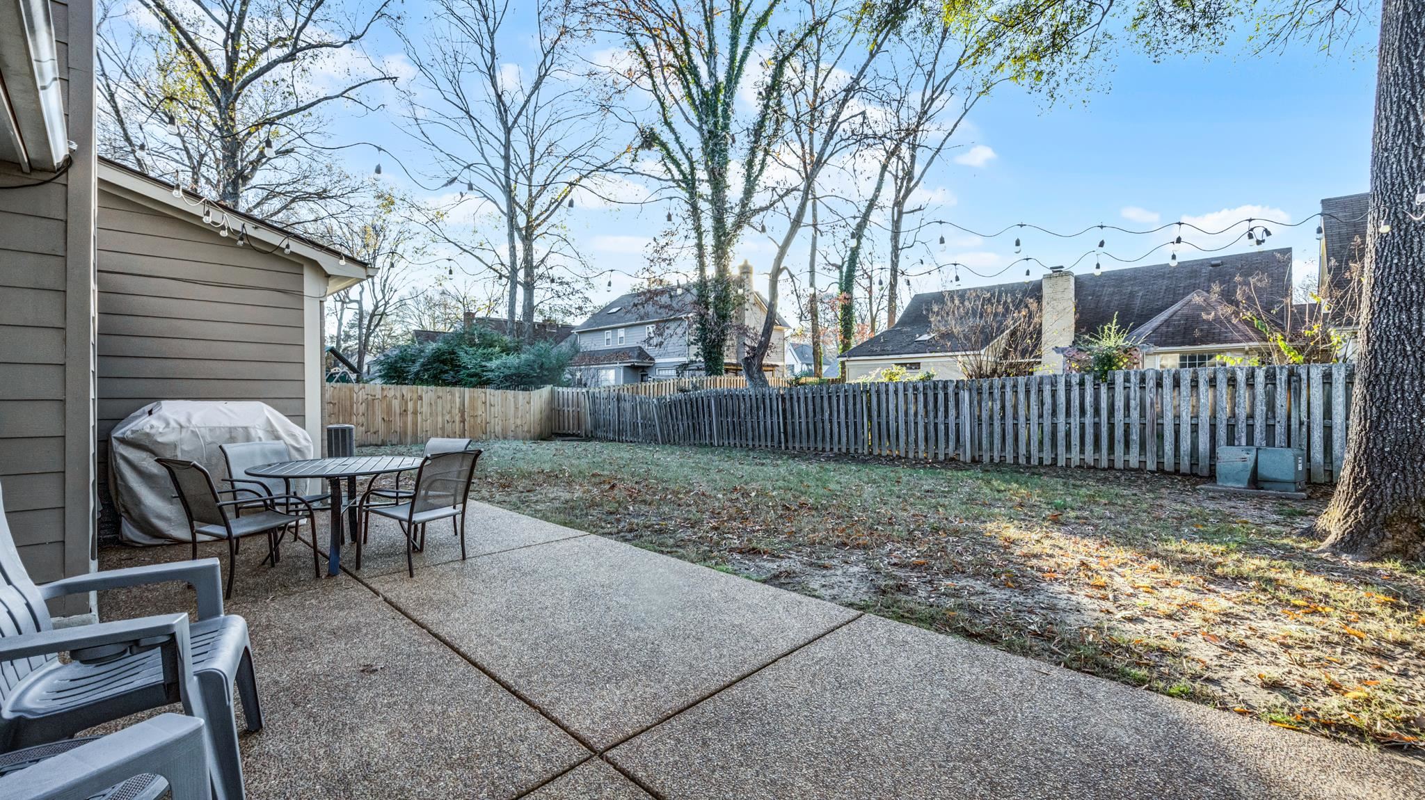 1883 Edwards Mill Road Germantown, TN 38139 - Photo 36 of 40 a view of a yard with furniture and wooden fence