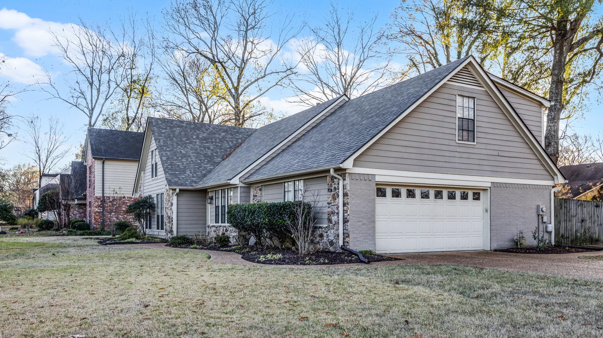 1883 Edwards Mill Road Germantown, TN 38139 - Photo 4 of 40 a view of a house with a yard