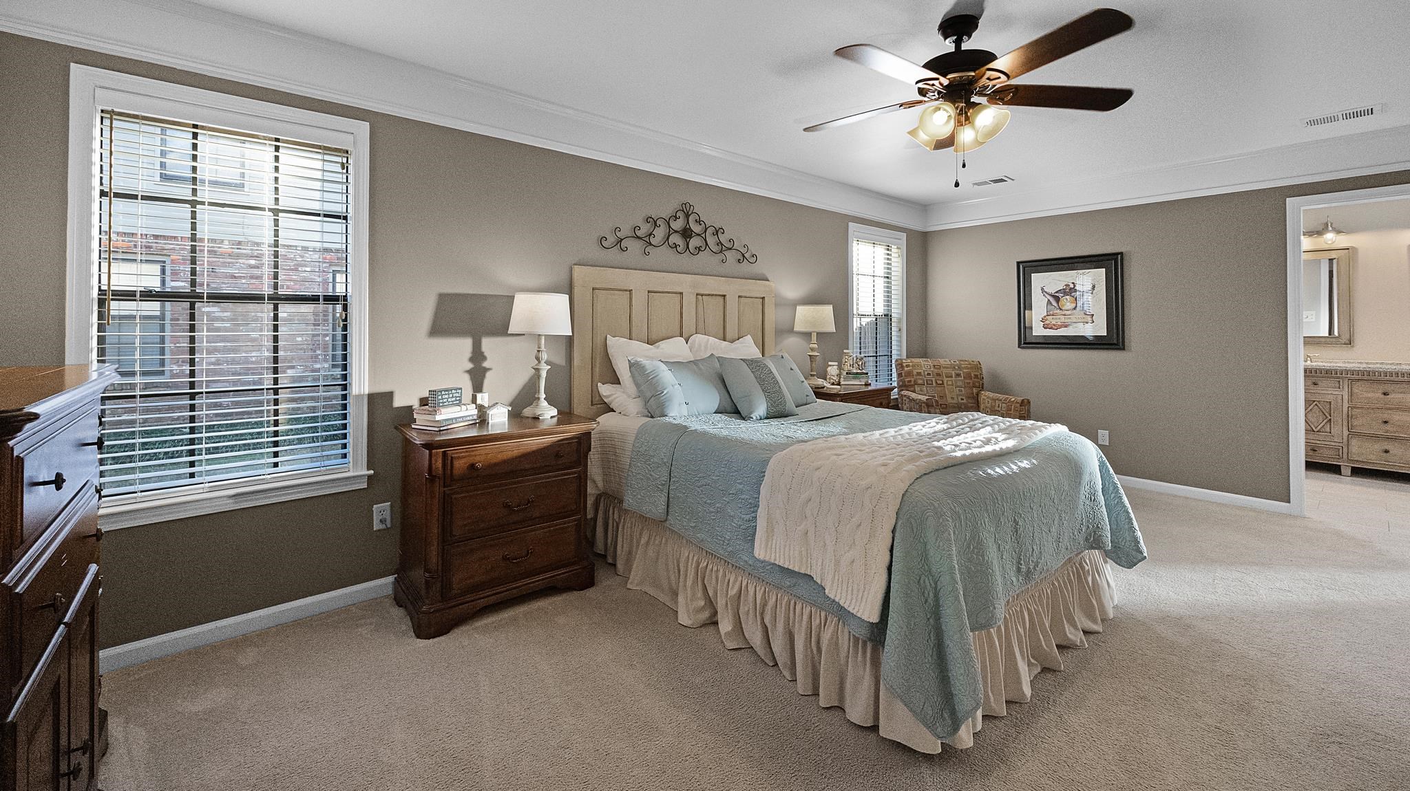 1883 Edwards Mill Road Germantown, TN 38139 - Photo 7 of 40 a bedroom with a bed and a chandelier