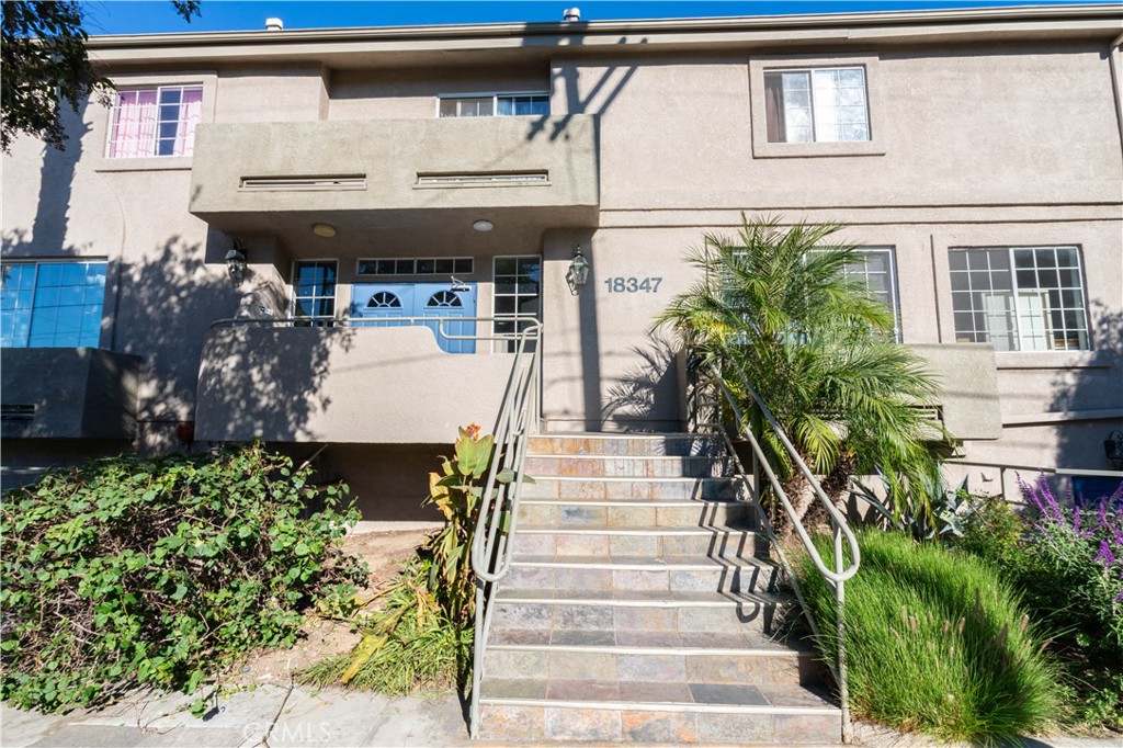 18347 Saticoy Street, Unit 28 Reseda, CA 91335 - Photo 21 of 27 a view of a building with sitting area