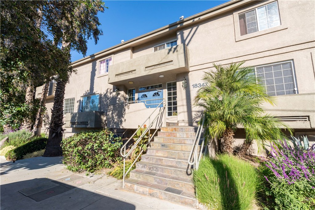 18347 Saticoy Street, Unit 28 Reseda, CA 91335 - Photo 22 of 27 a view of a potted plants on a sidewalk