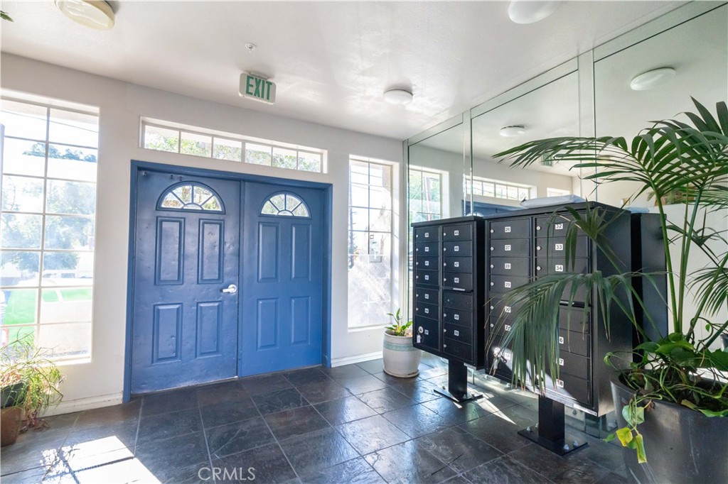 18347 Saticoy Street, Unit 28 Reseda, CA 91335 - Photo 25 of 27 a view of entryway with a potted plant and windows