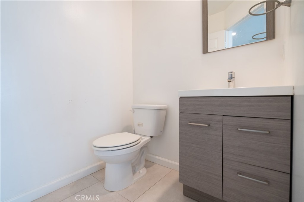 18347 Saticoy Street, Unit 28 Reseda, CA 91335 - Photo 7 of 27 a bathroom with a toilet and a sink