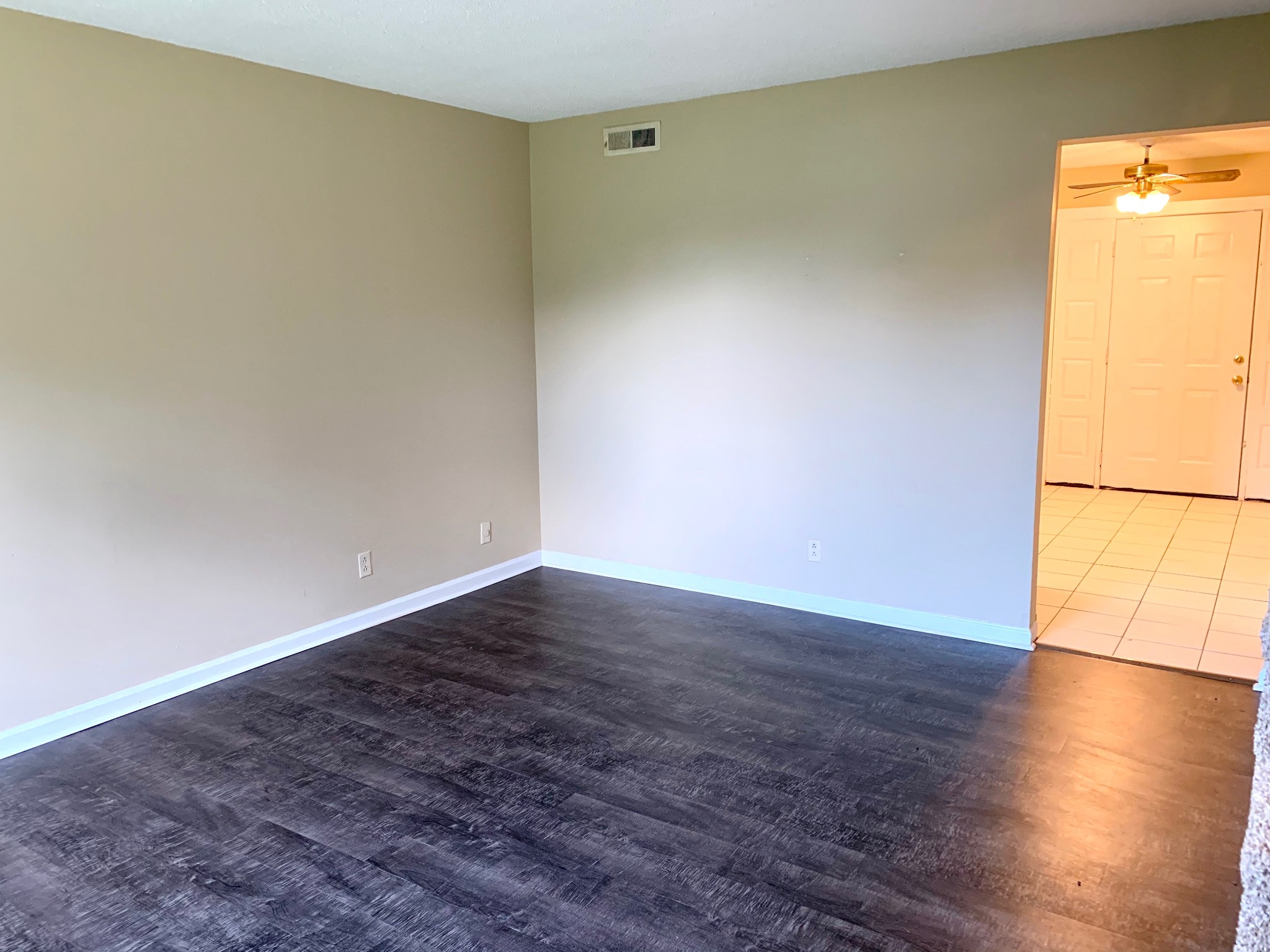 1209 State Line Road, Unit 49 Oak Grove, KY 42262 - Photo 2 of 11 a view of an empty room with wooden floor and a window