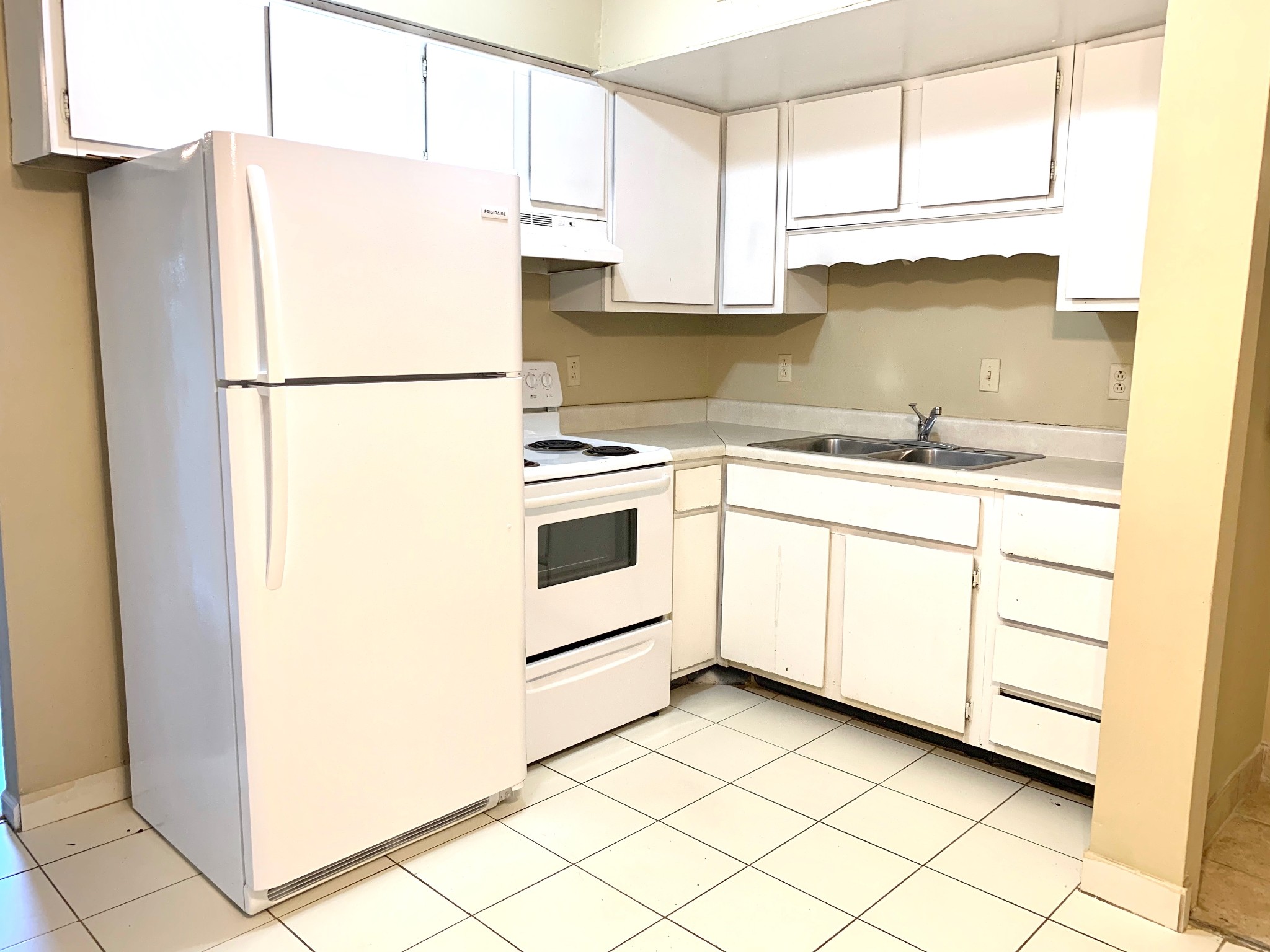 1209 State Line Road, Unit 49 Oak Grove, KY 42262 - Photo 5 of 11 a kitchen with a sink a stove a refrigerator and a window