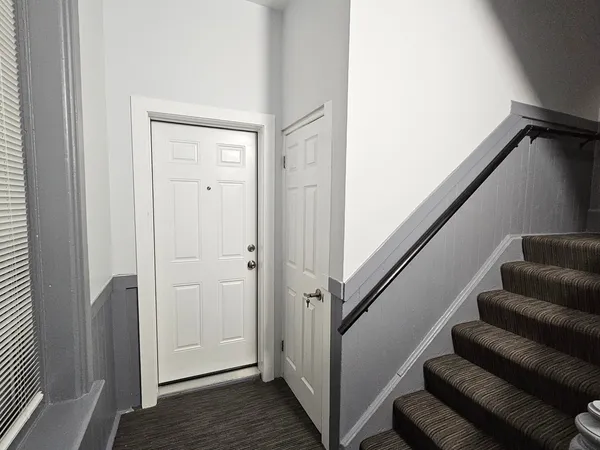 a view of entryway with wooden floor