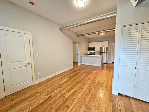 a view of a kitchen from the hallway