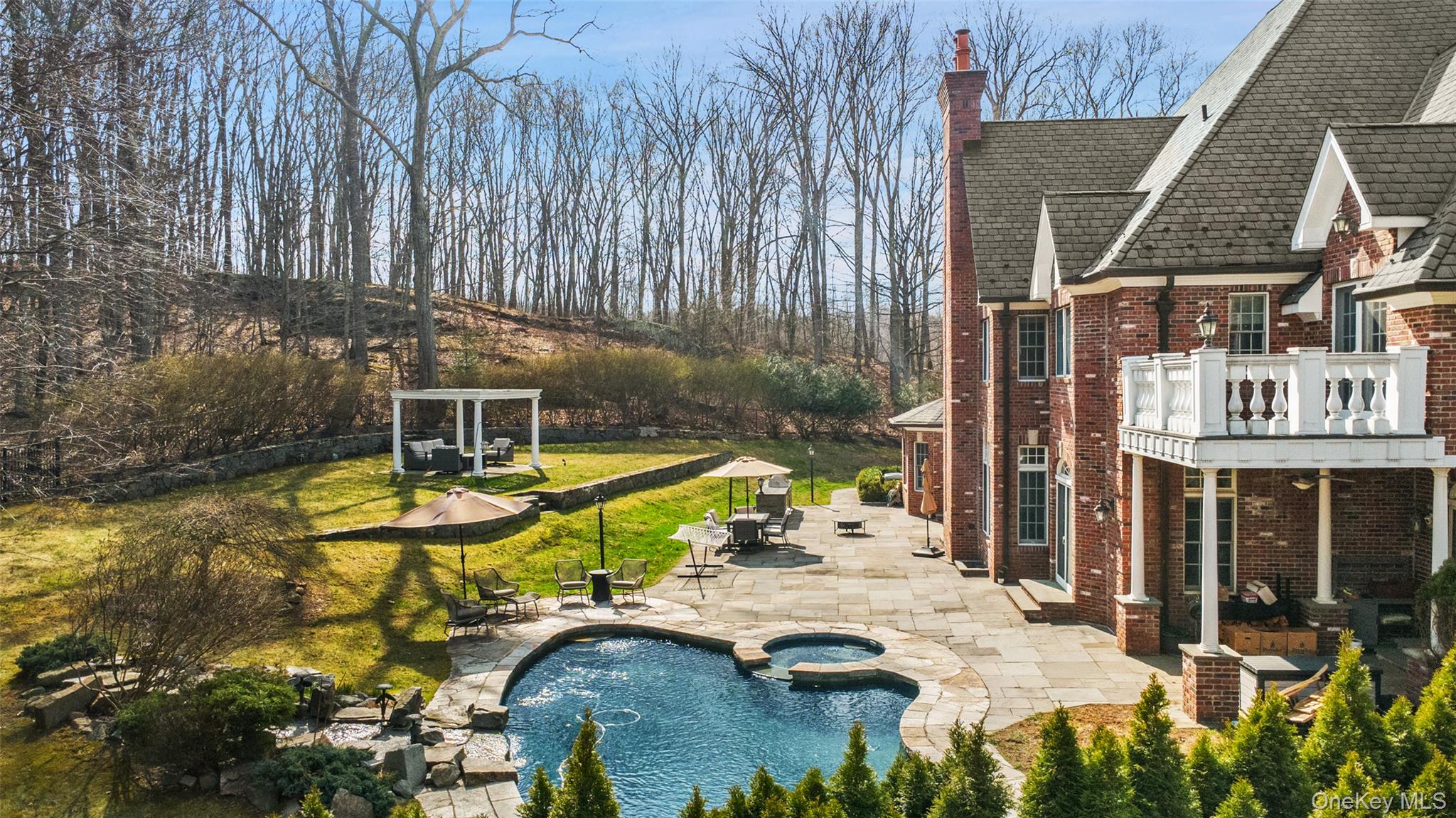 241 North Salem Road Waccabuc, NY 10597 - Photo 2 of 48 a view of a swimming pool with a patio