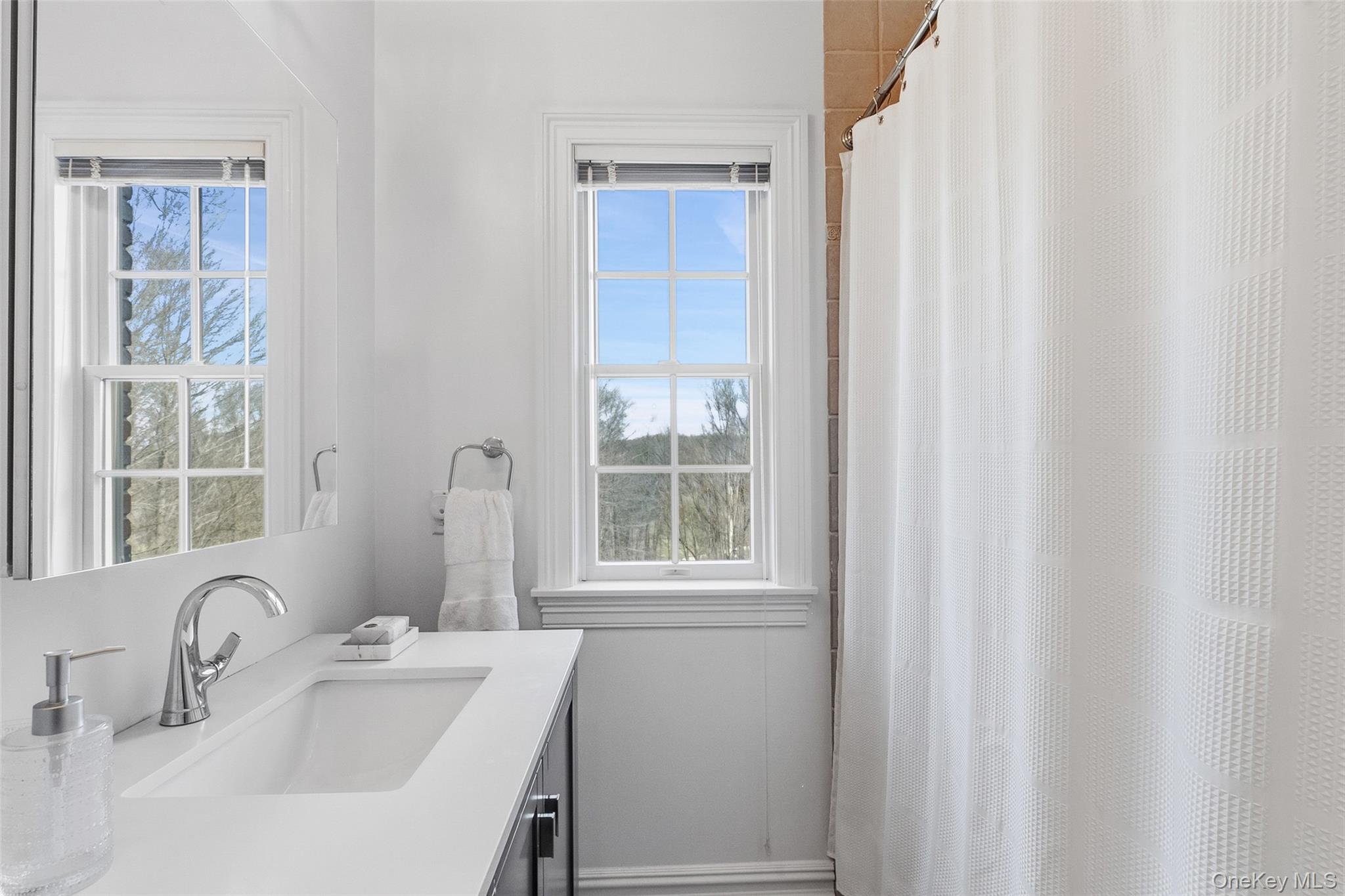 241 North Salem Road Waccabuc, NY 10597 - Photo 32 of 48 a bathroom with a sink and a window