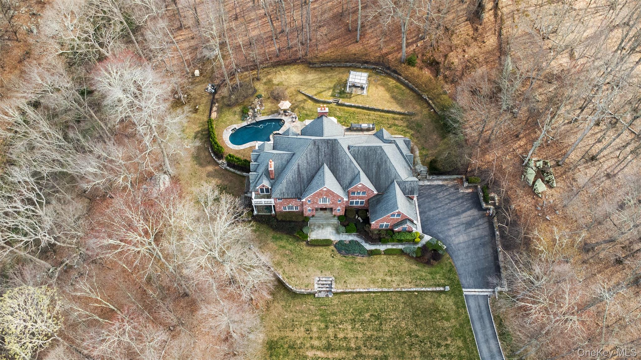 241 North Salem Road Waccabuc, NY 10597 - Photo 40 of 48 an aerial view of a house with swimming pool