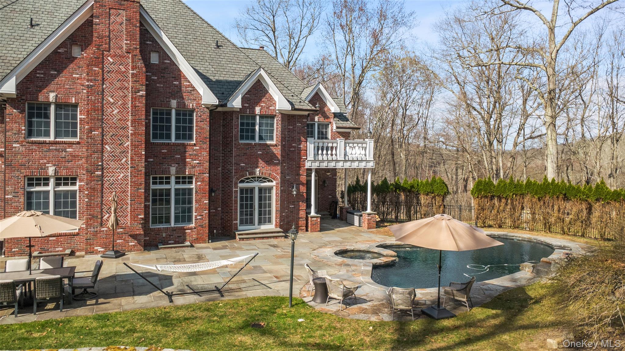241 North Salem Road Waccabuc, NY 10597 - Photo 44 of 48 a view of a patio with table and chairs under an umbrella