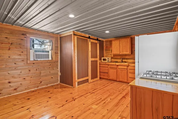 a view of a kitchen with wooden floor