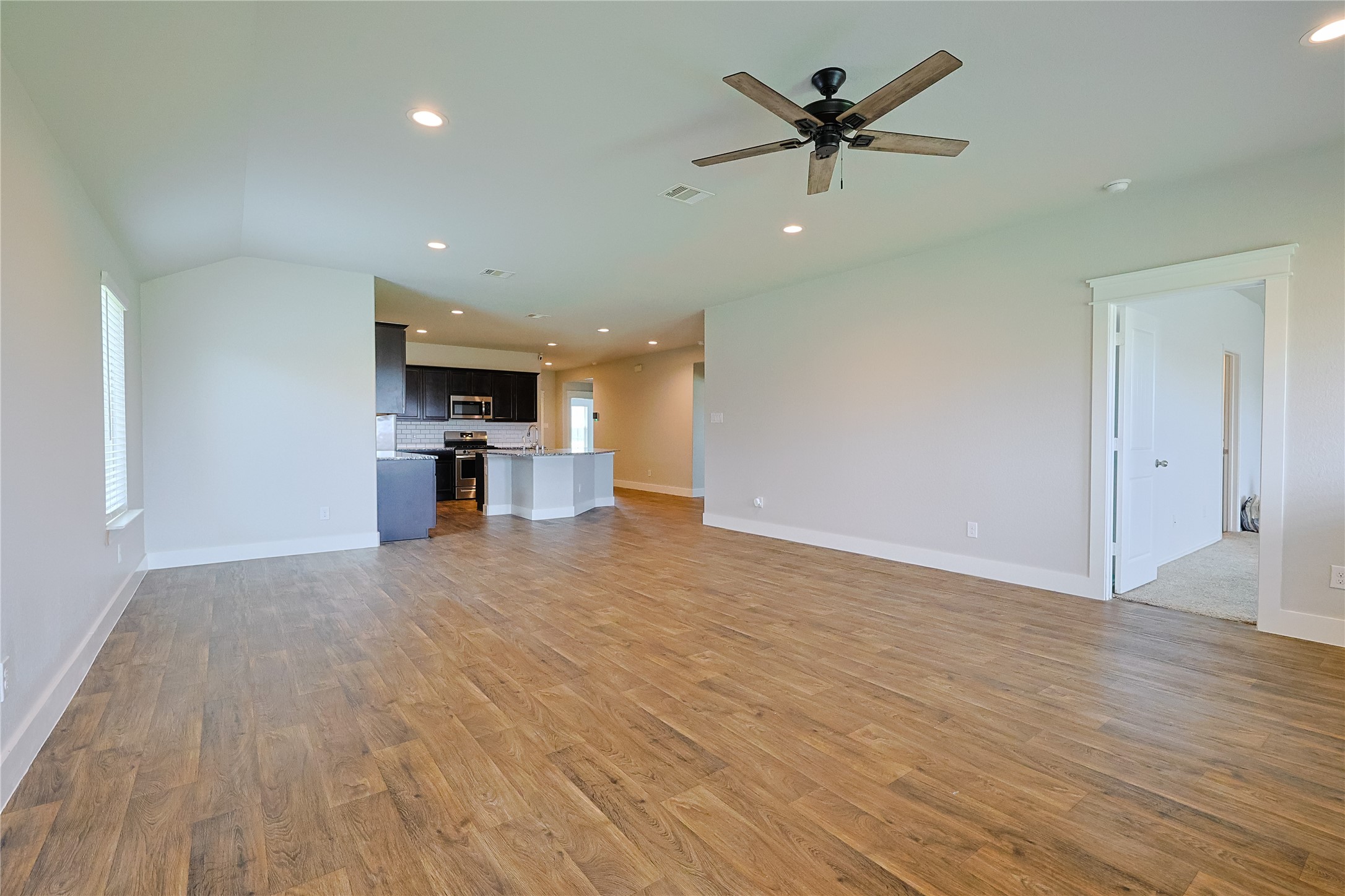 707 Acacia Park Lane Rosharon, TX 77583 - Photo 10 of 24 Open concept view Family room to Kitchen