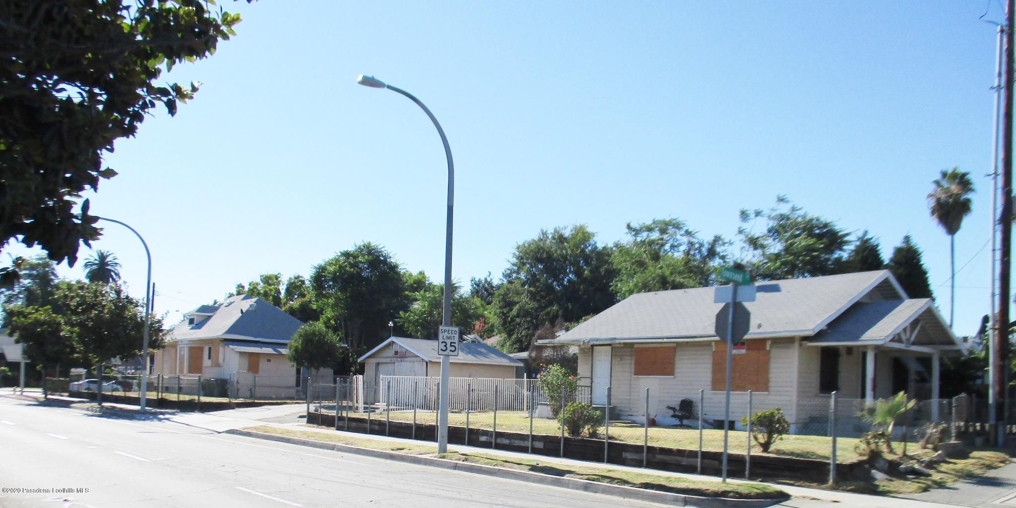 396 North Summit Avenue Pasadena, CA 91103 - Photo 1 of 12 a front view of a house with a garden