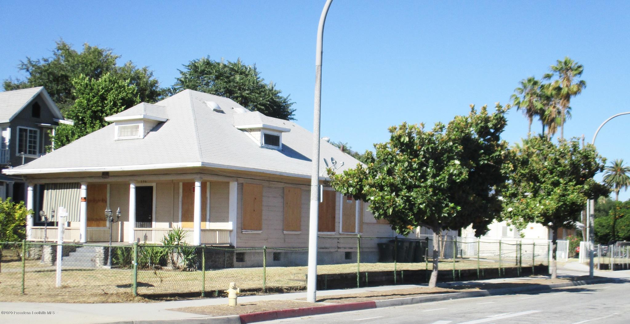 396 North Summit Avenue Pasadena, CA 91103 - Photo 5 of 12 a front view of a house with a yard