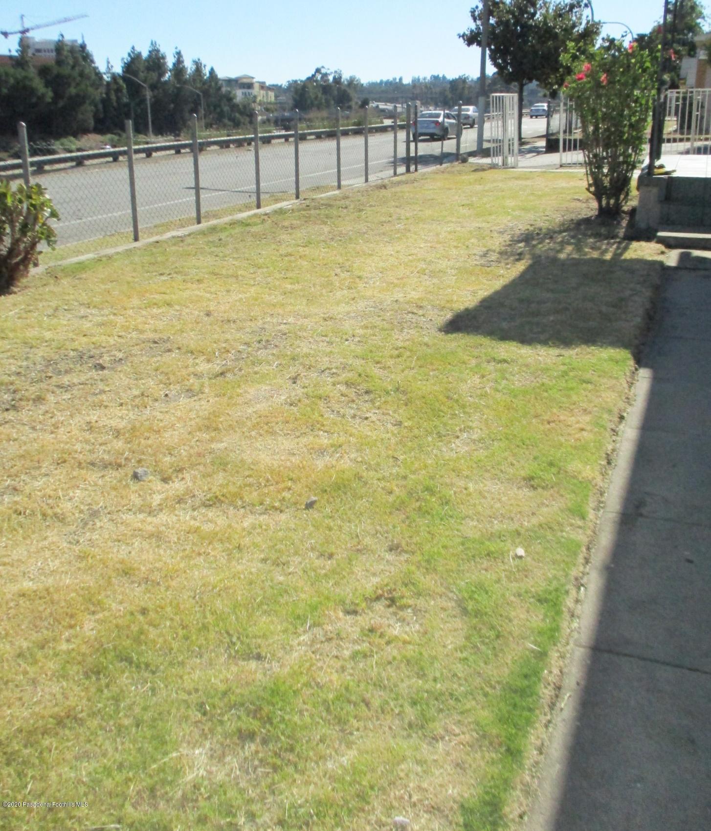 396 North Summit Avenue Pasadena, CA 91103 - Photo 6 of 12 a swimming pool with lawn chairs