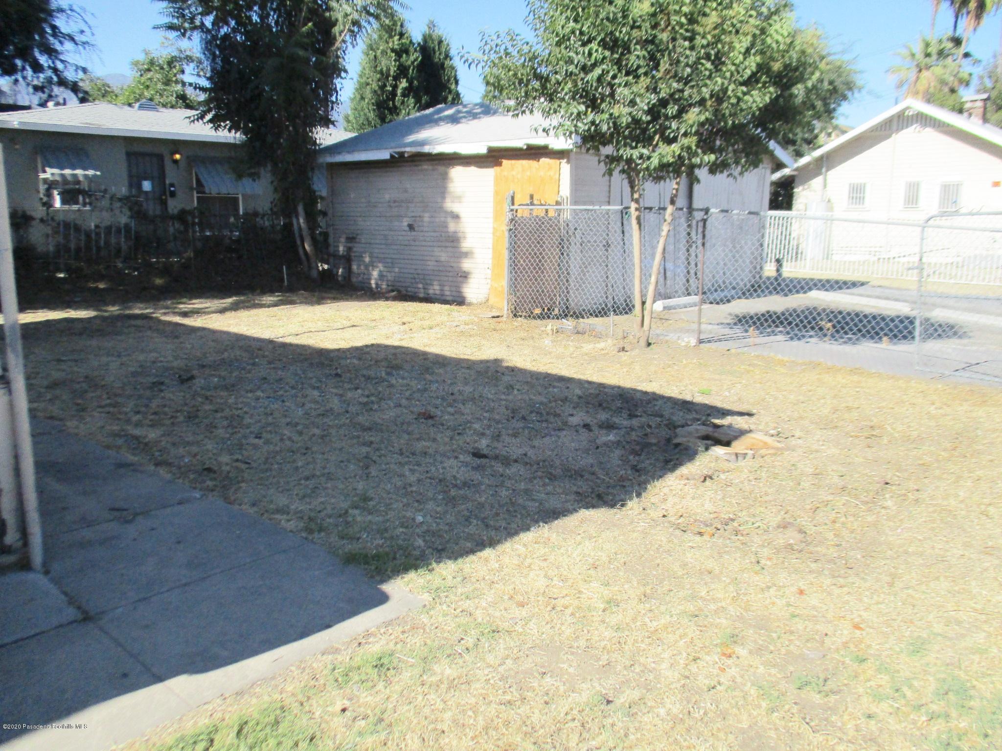 396 North Summit Avenue Pasadena, CA 91103 - Photo 7 of 12 a view of a house with a yard and large tree