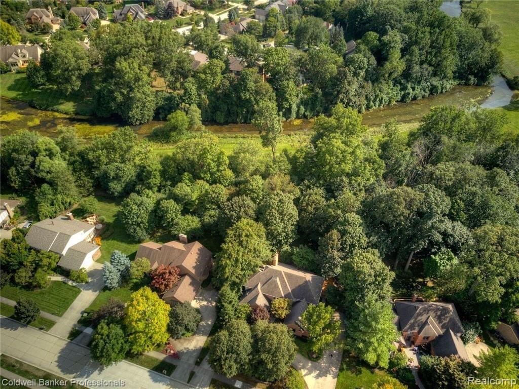 4780 Rivers Edge Drive Troy, MI 48098 - Photo 9 of 53 4780 - Exterior - Backs to Woods, Commons, & River.jpeg