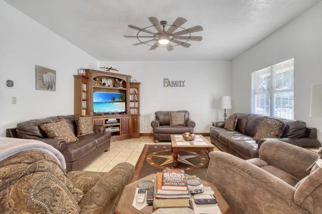 a living room with furniture and a large window
