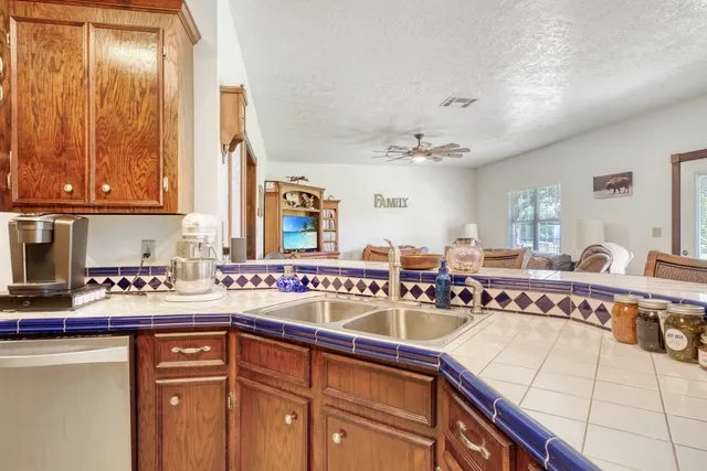 a kitchen with a sink and cabinets