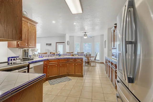 a kitchen with stainless steel appliances granite countertop counter space a sink and cabinets