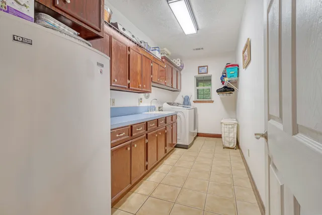 a kitchen with stainless steel appliances a sink and a refrigerator