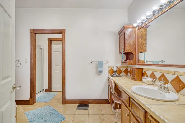 a bathroom with a sink and a mirror