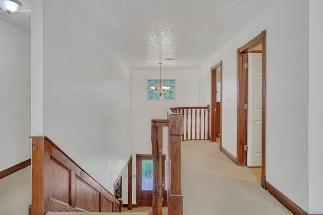 a view of a hallway with windows