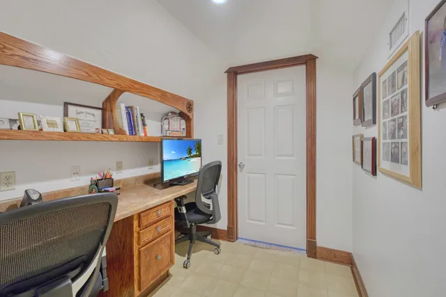 a view of a workspace with furniture