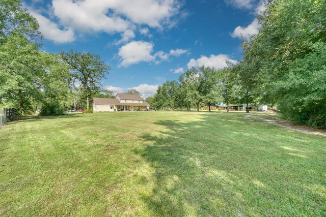 a backyard of a house with lots of green space