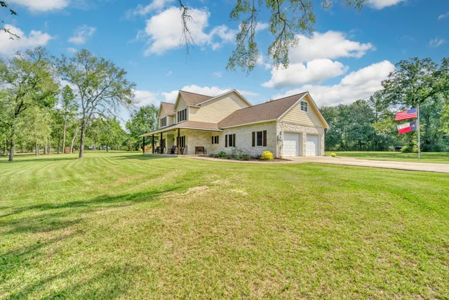 a view of a house with a big yard