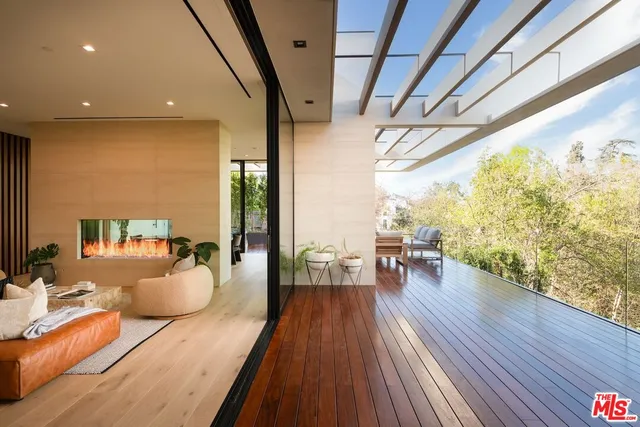 a dining room with wooden floor and furniture