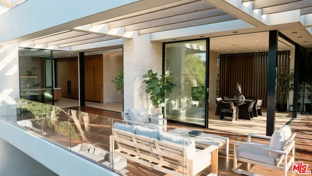 a view of living room and patio