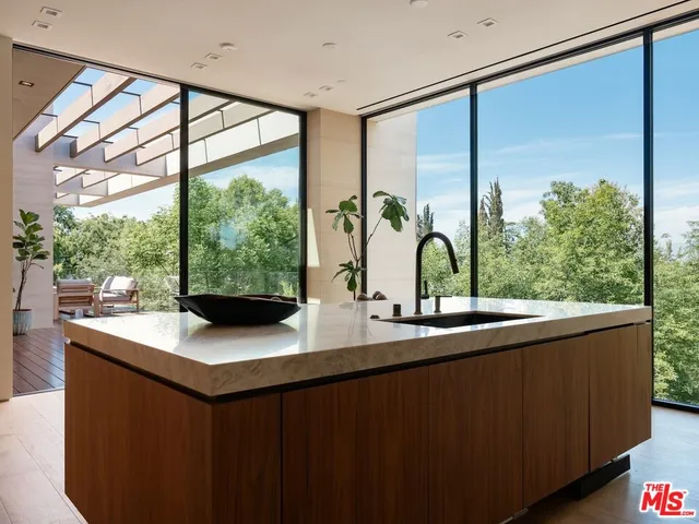 a view of kitchen sink and window