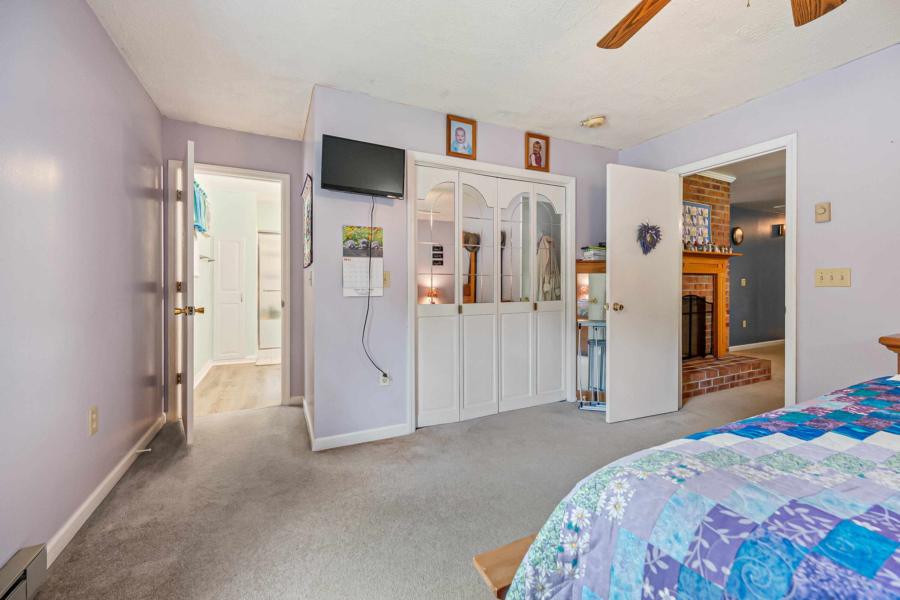 1365 Brake Road Elliston, VA 24087 - Photo 18 of 98 a spacious bedroom with a bed and a flat screen tv