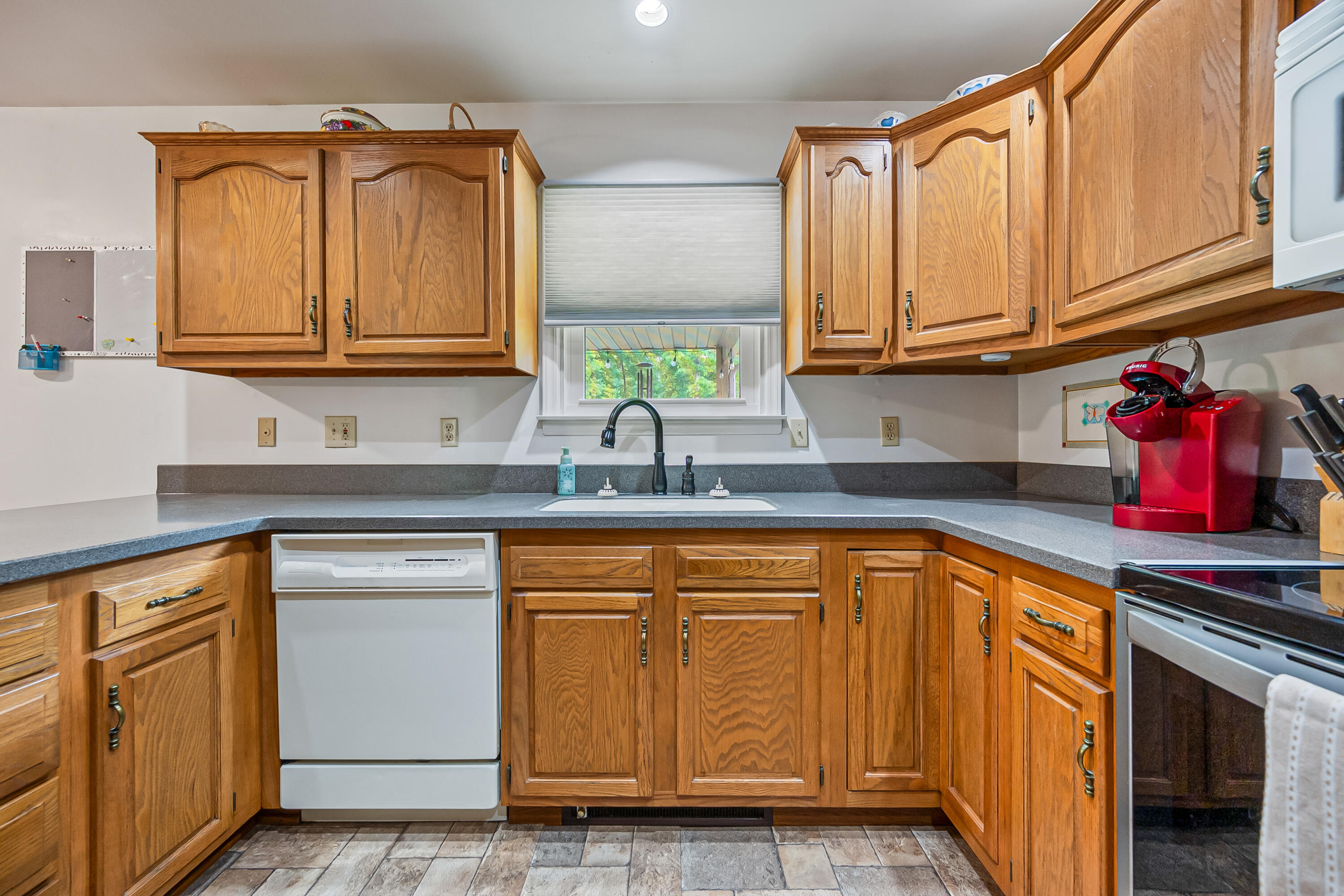 1365 Brake Road Elliston, VA 24087 - Photo 24 of 98 a kitchen with stainless steel appliances granite countertop a sink stove and cabinets