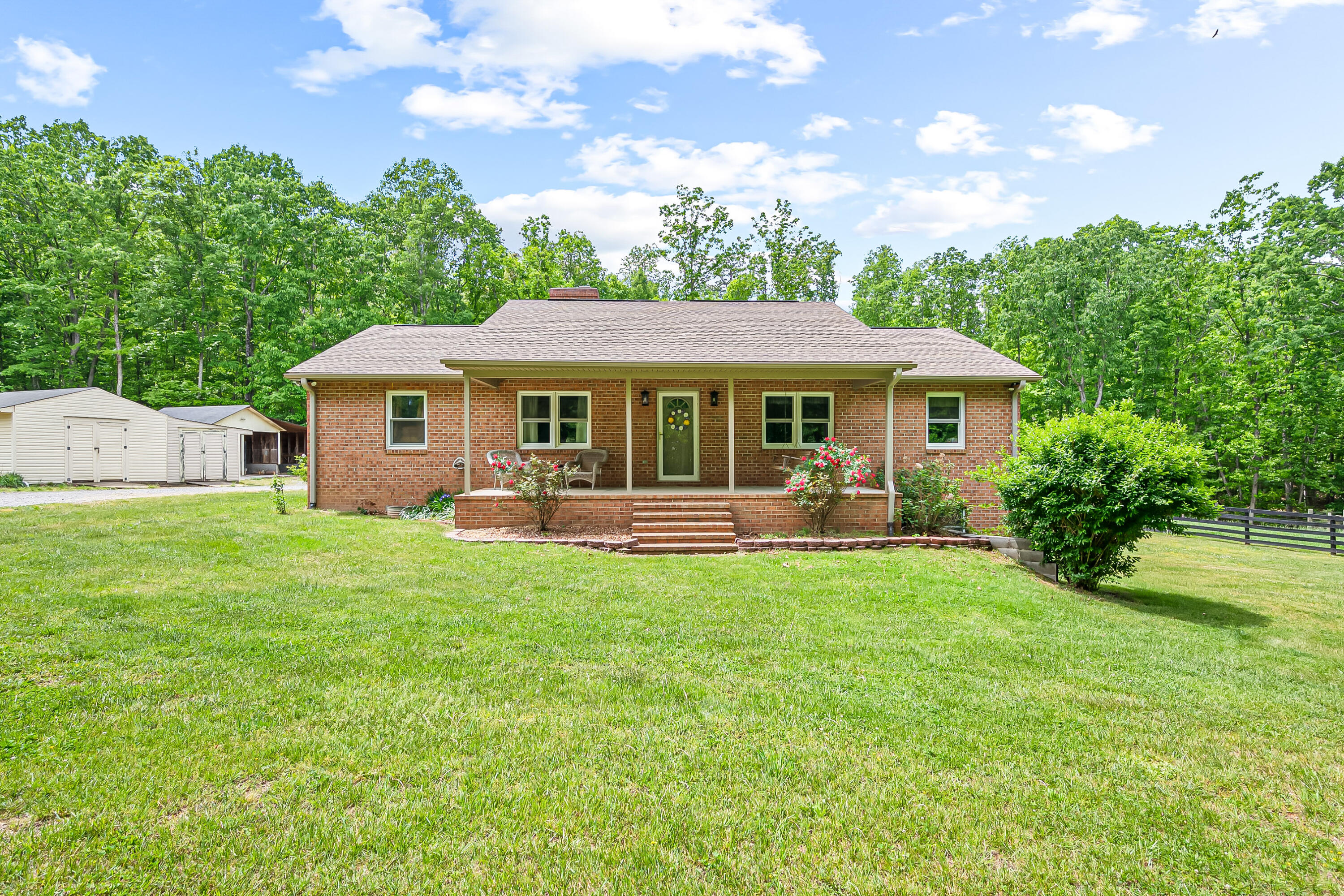 1365 Brake Road Elliston, VA 24087 - Photo 5 of 98 a view of a house with a backyard and a patio