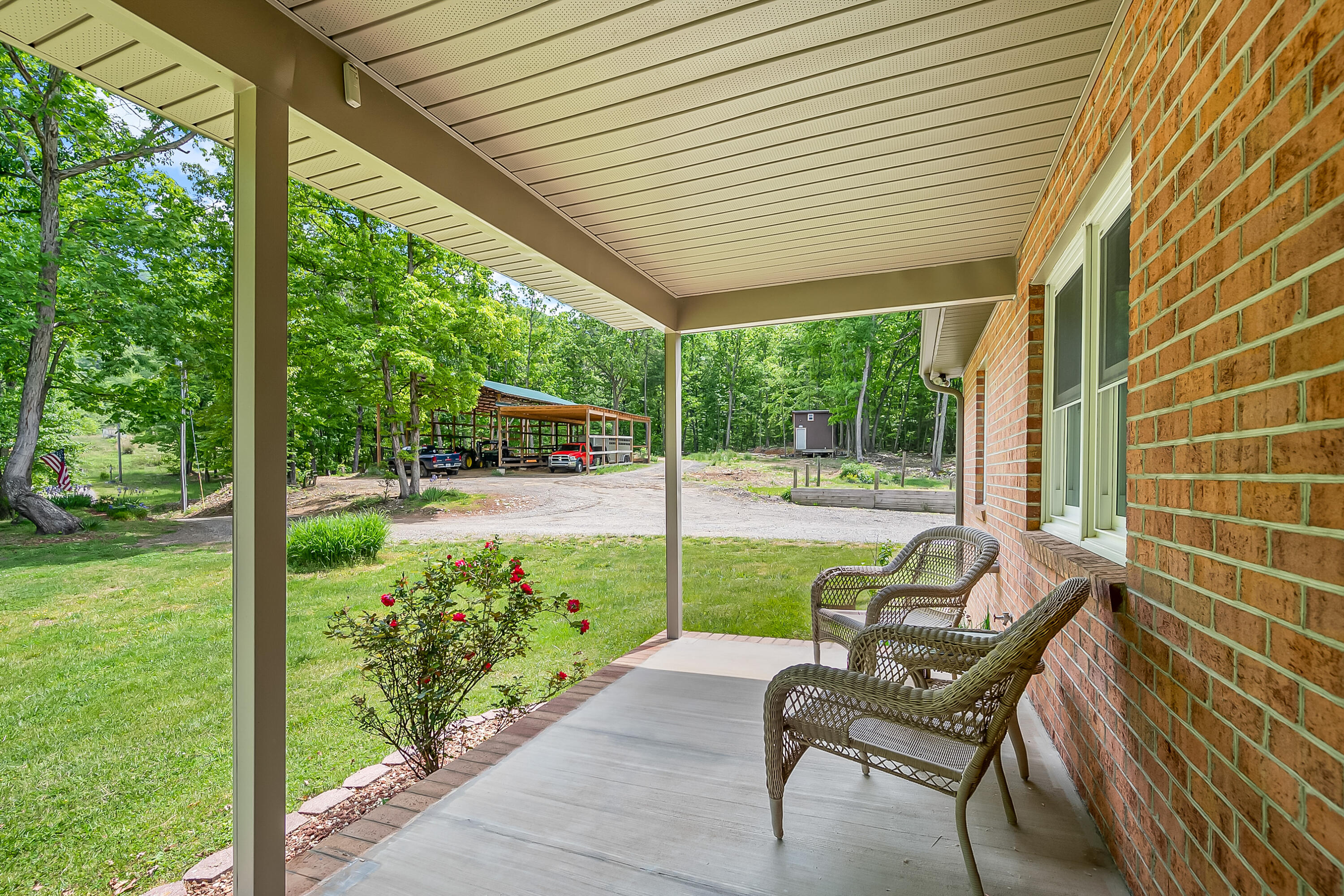 1365 Brake Road Elliston, VA 24087 - Photo 6 of 98 a view of a chair and tables in the patio next to a yard