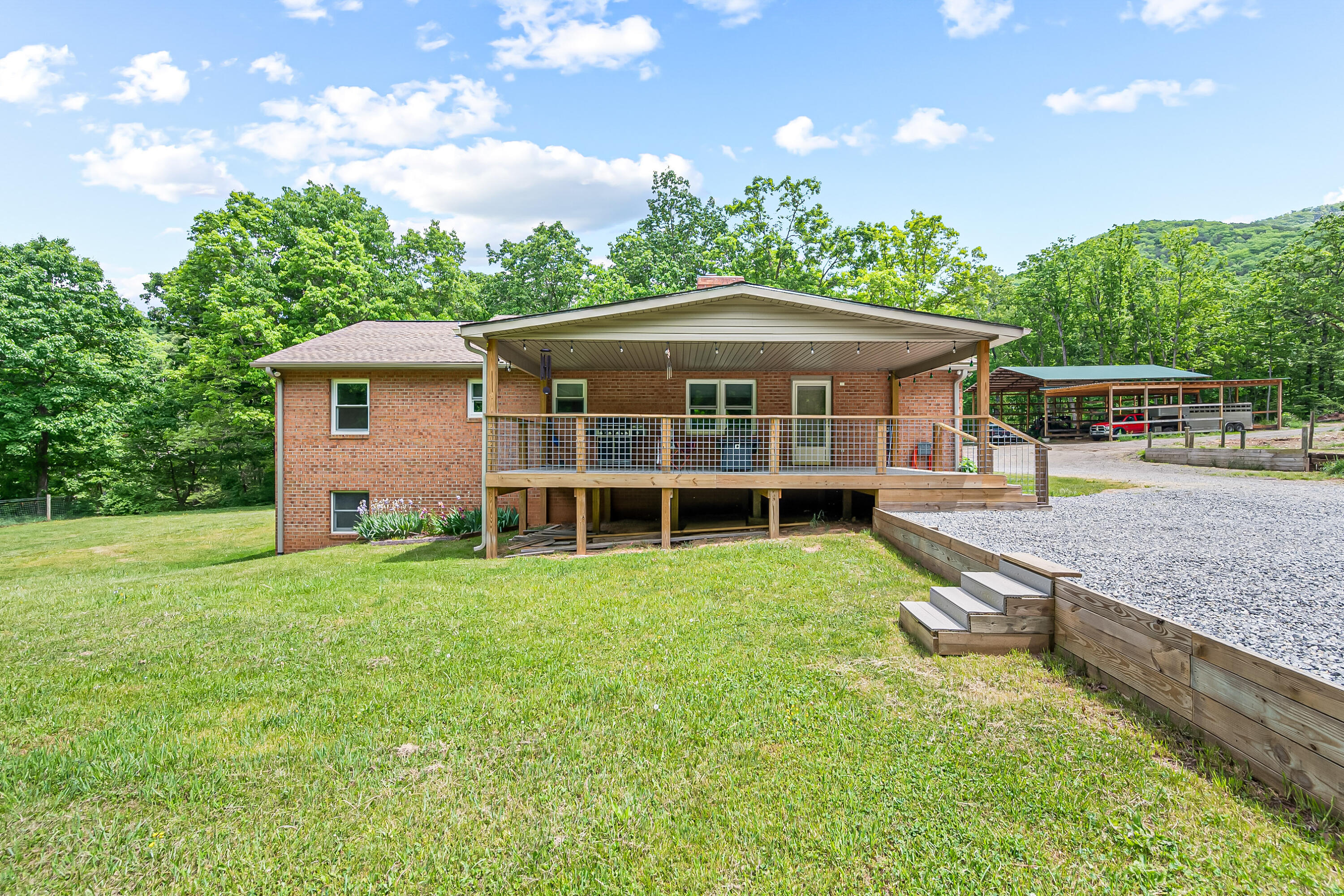 1365 Brake Road Elliston, VA 24087 - Photo 65 of 98 a front view of a house with a garden