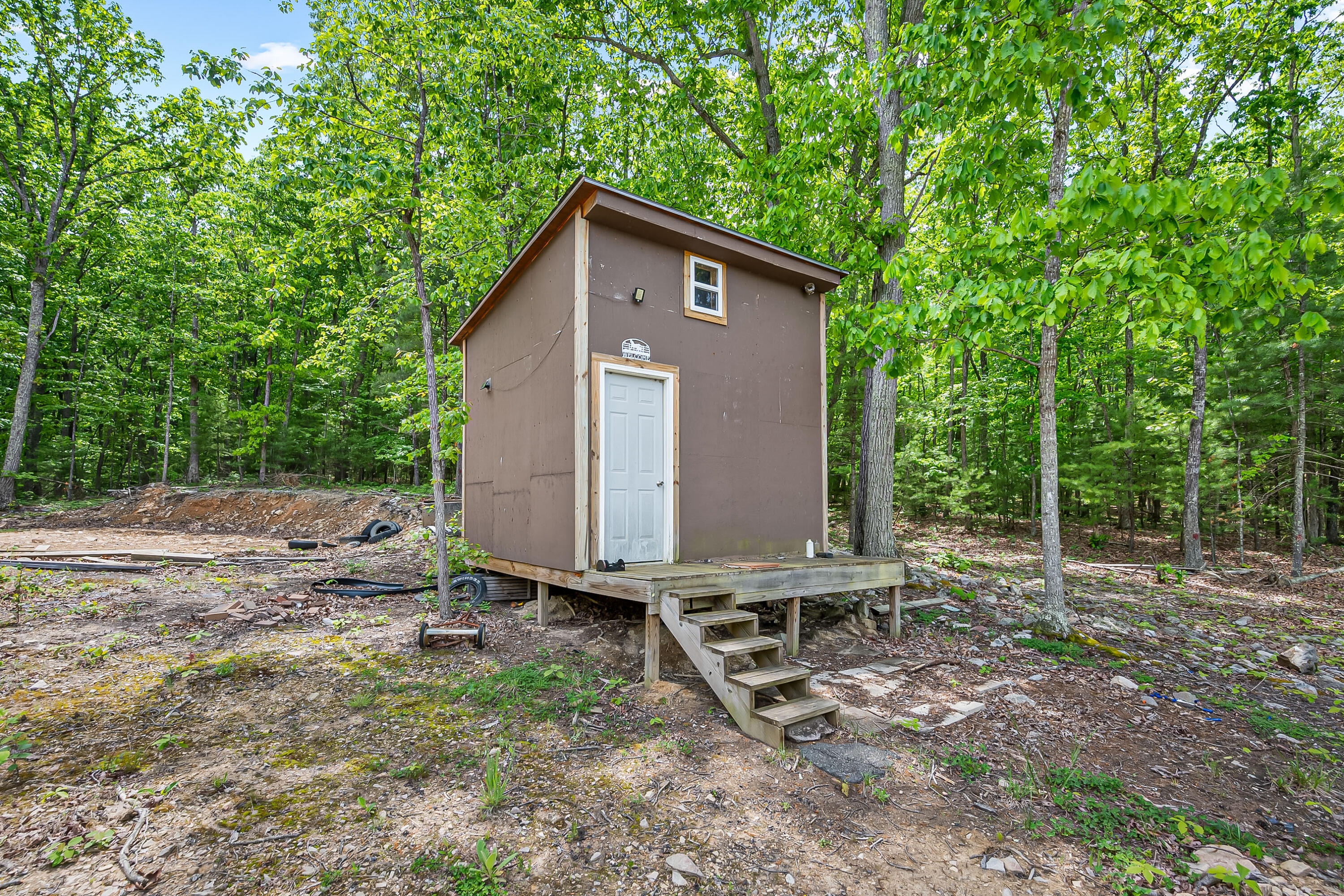 1365 Brake Road Elliston, VA 24087 - Photo 75 of 98 a backyard of a house with large trees and wooden fence